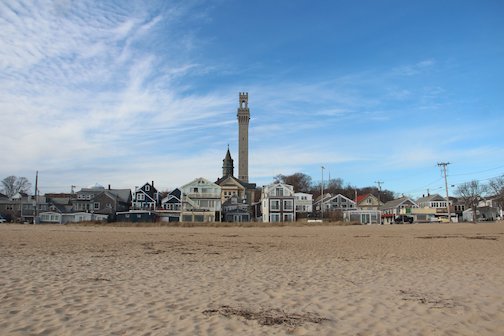 Waterfront low tide view with Pilgrim Monument and Provincetown Town Hall